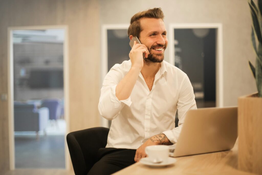AI receptionist for small business owner taking a call at his desk