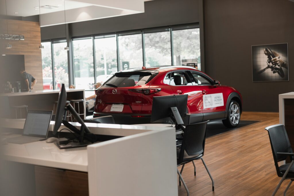 Car showroom with a red vehicle on display