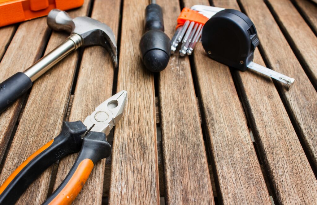 Carpentry hand tools on a wooden surface