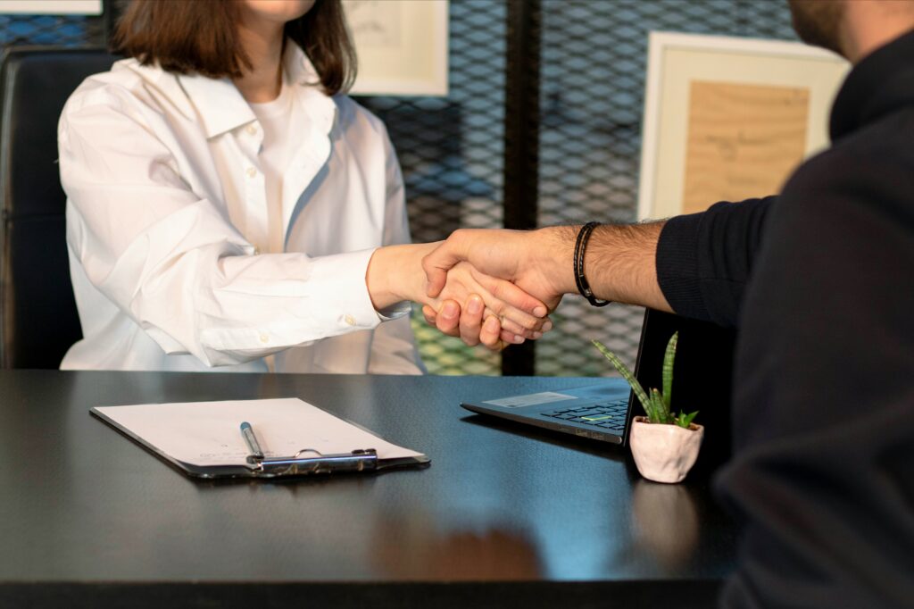 Insurance agent shaking hands with a client