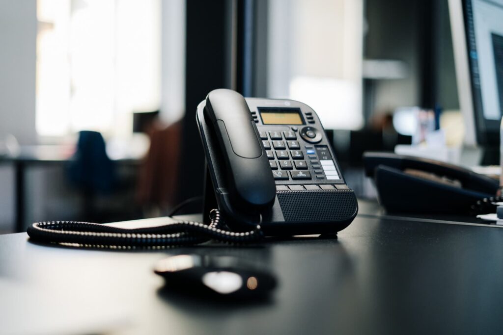 Office desk phone representing inbound AI calls answered by StudioMeta on WordPress